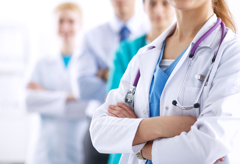 42234811 – attractive female doctor in front of medical group .